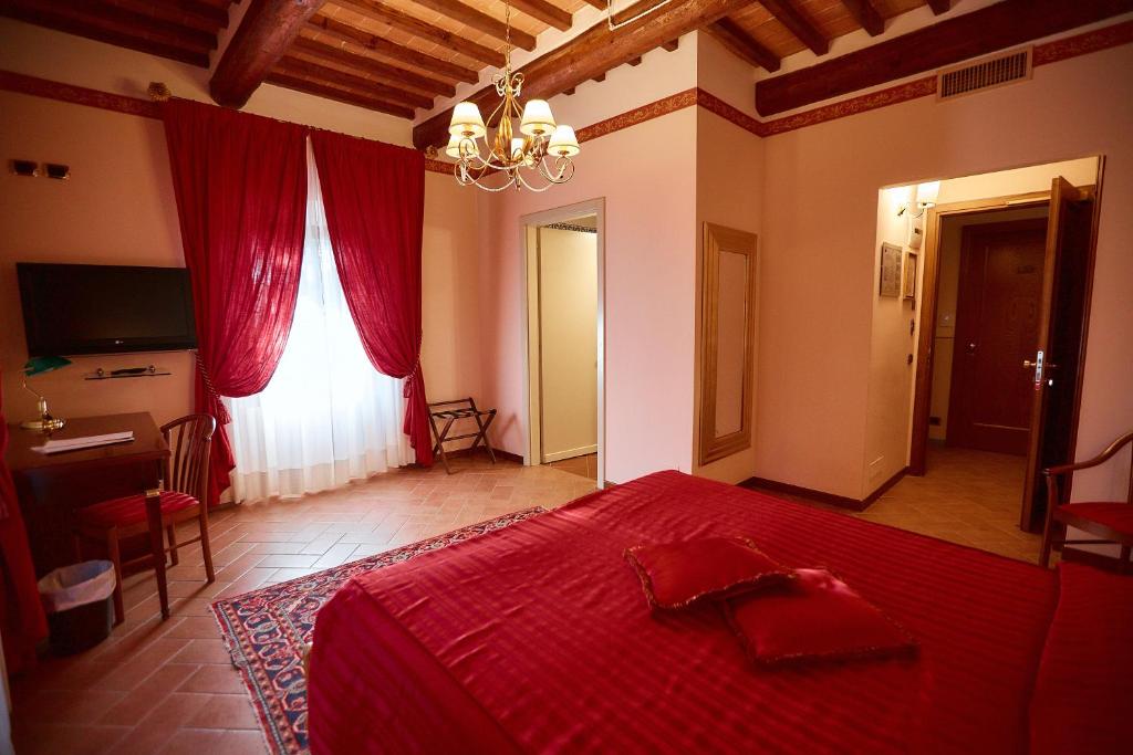 Posteľ alebo postele v izbe v ubytovaní Hotel Villa Il Patriarca
