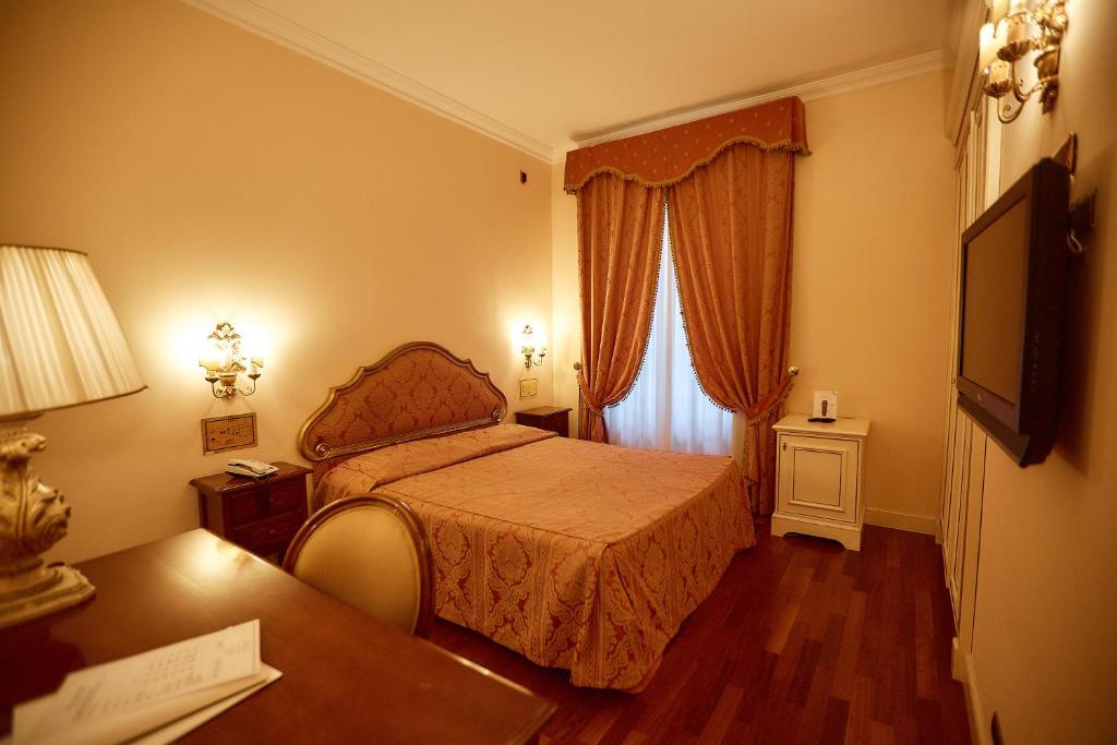 Posteľ alebo postele v izbe v ubytovaní Hotel Villa Il Patriarca