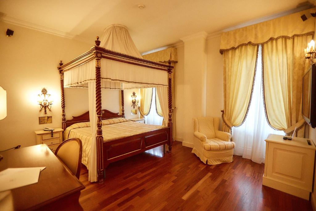 Posteľ alebo postele v izbe v ubytovaní Hotel Villa Il Patriarca
