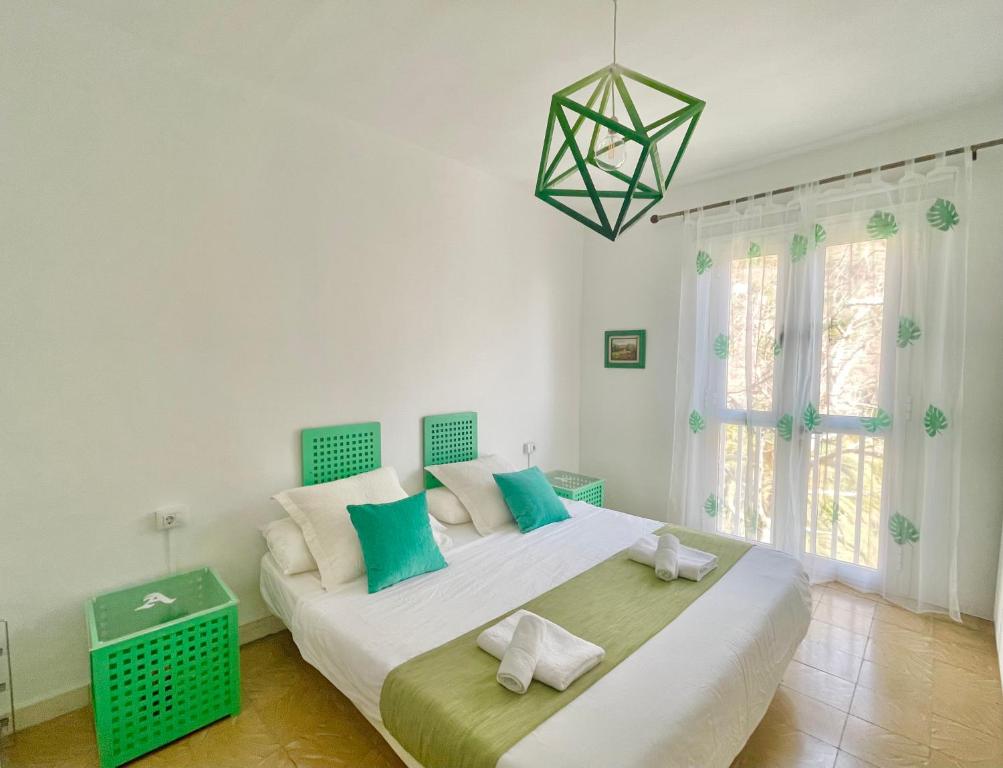 A bed or beds in a room at Casa Rural Arturo