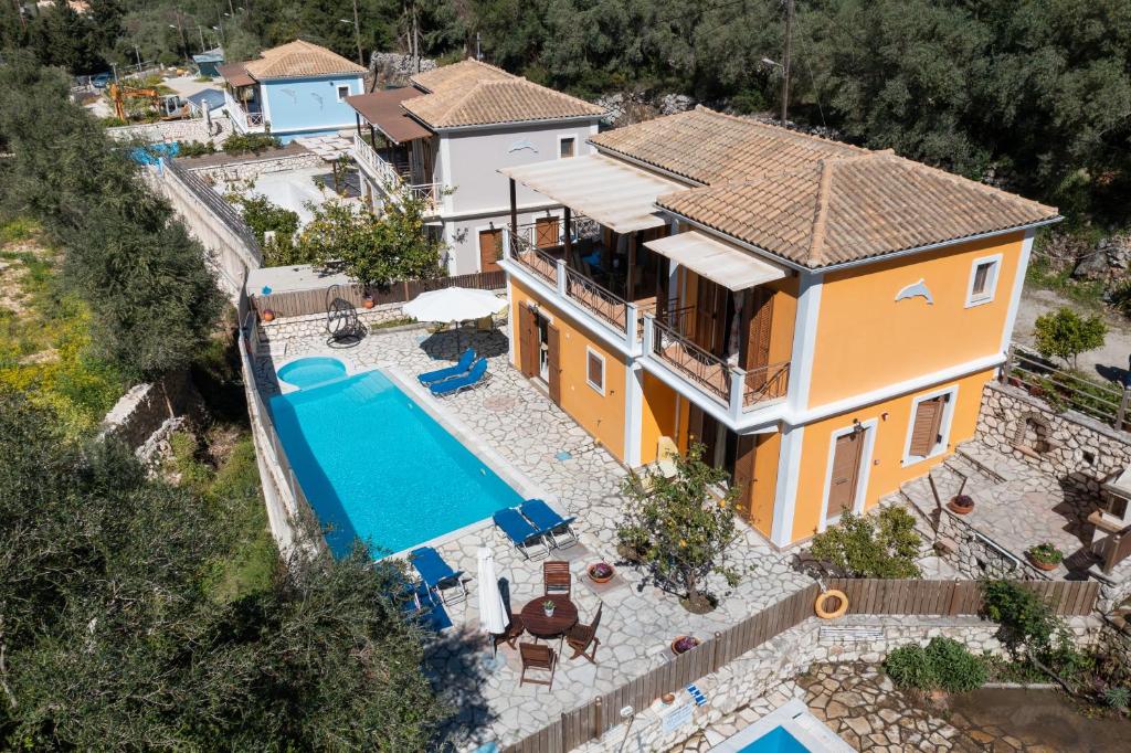 an aerial view of a house with a swimming pool at DELPHINUS VILLAS-Villa Nikitas in Agios Nikitas