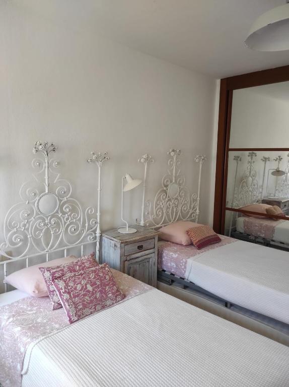 Łóżko lub łóżka w pokoju w obiekcie CASA 4 HABITACIONES CON JARDIN 10 Pax
