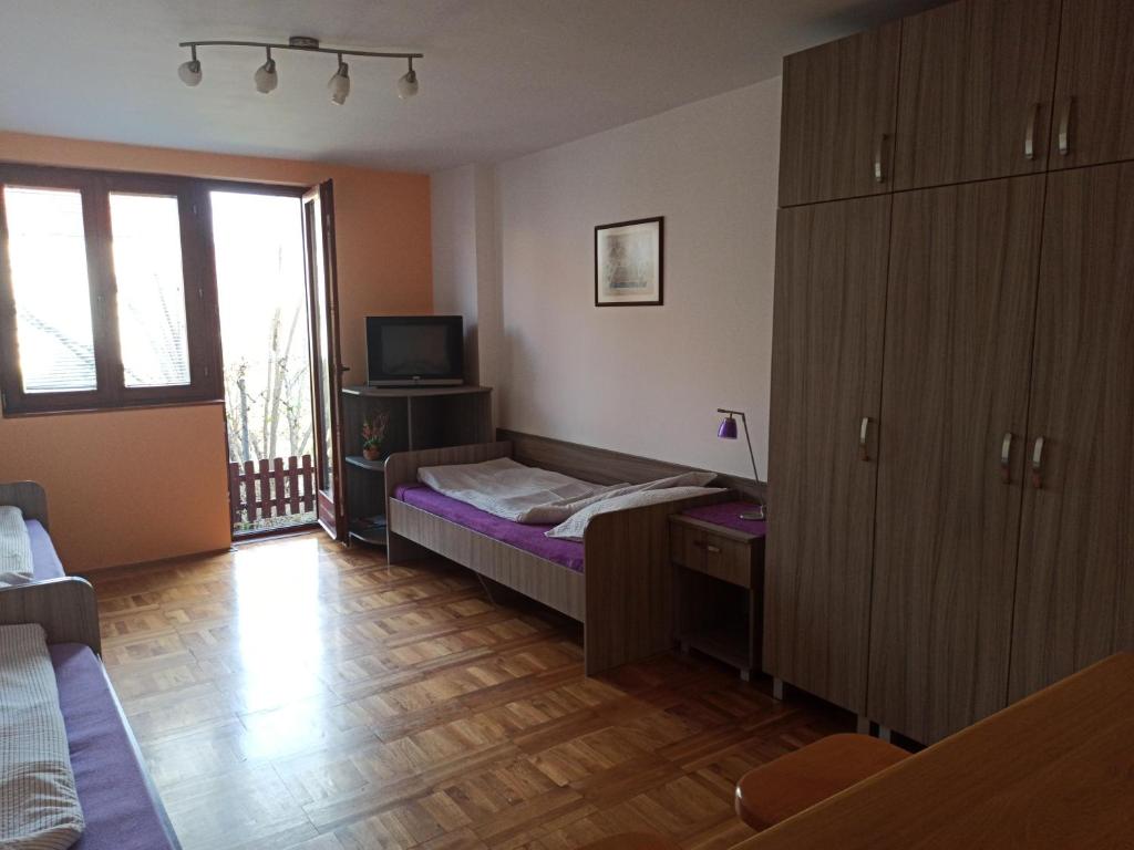 Postel nebo postele na pokoji v ubytování Apartman Ristic