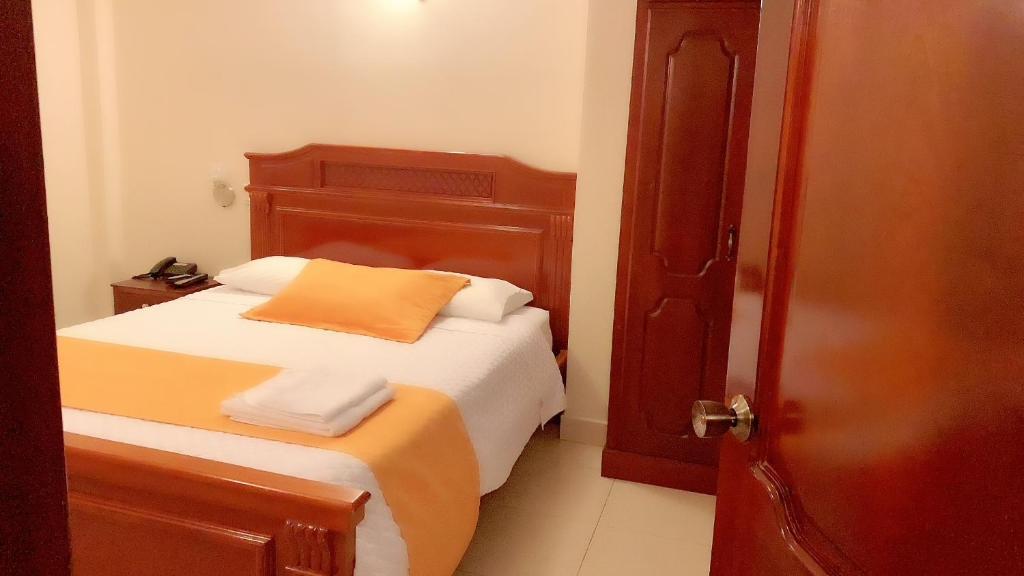 Postel nebo postele na pokoji v ubytování Hotel Caluva