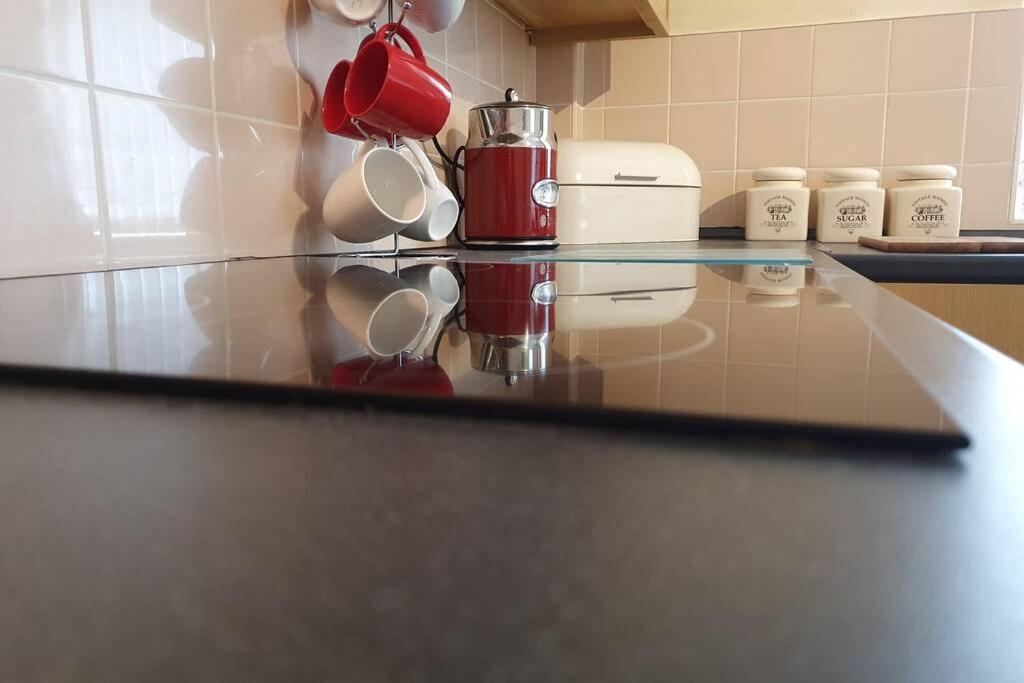a counter in a kitchen with a coffee maker on it at Pomfret House, in Burnley Central, Ideal for Contractors with Free Parking and Wifi in Burnley