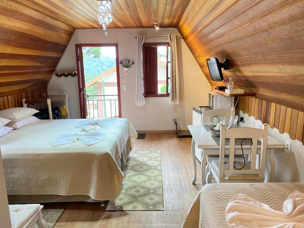 Postel nebo postele na pokoji v ubytování Chalés Paraíso Monte Verde