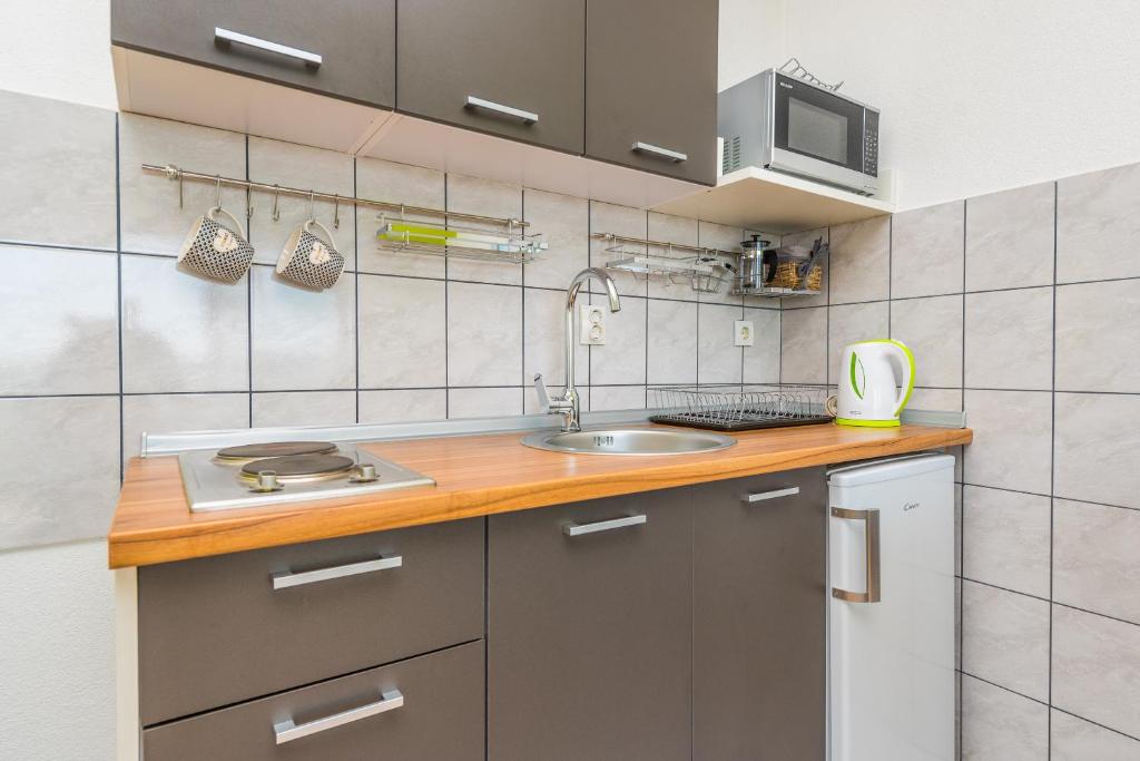 Kuchyňa alebo kuchynka v ubytovaní Apartments Marko Dominik