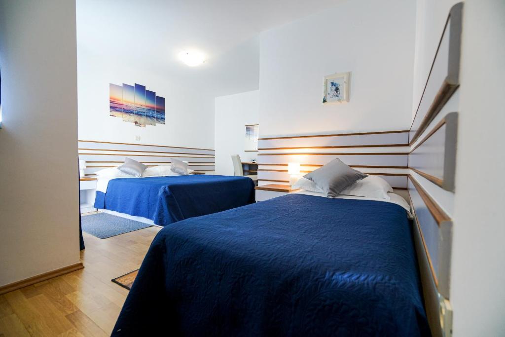 Posteľ alebo postele v izbe v ubytovaní Hotel Belvedere