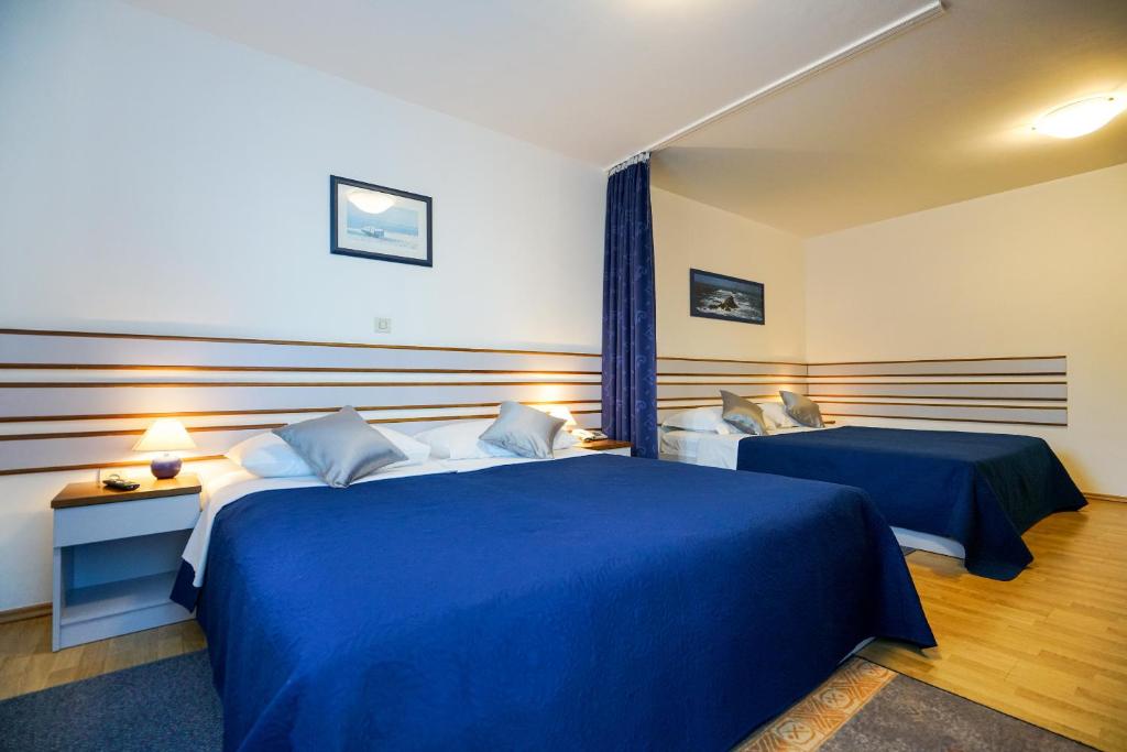 Posteľ alebo postele v izbe v ubytovaní Hotel Belvedere