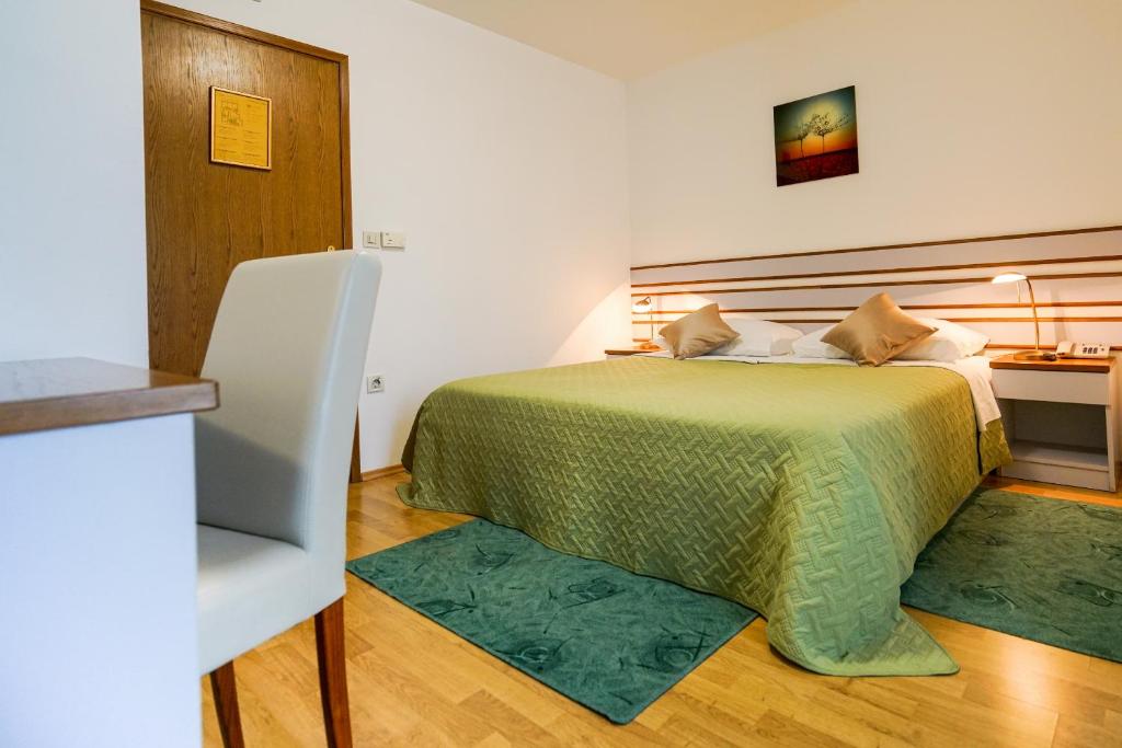 Posteľ alebo postele v izbe v ubytovaní Hotel Belvedere