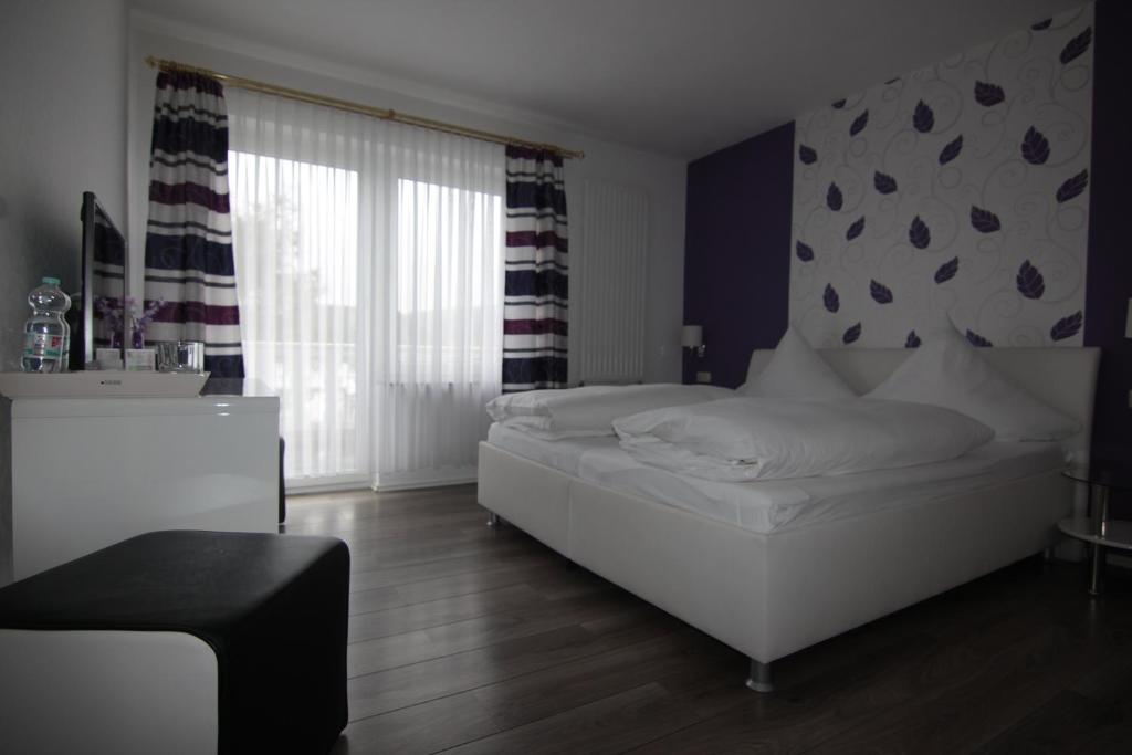 Postel nebo postele na pokoji v ubytování Hotel Linden