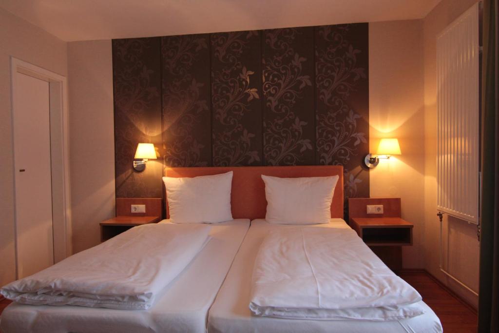 Postel nebo postele na pokoji v ubytování Hotel Linden