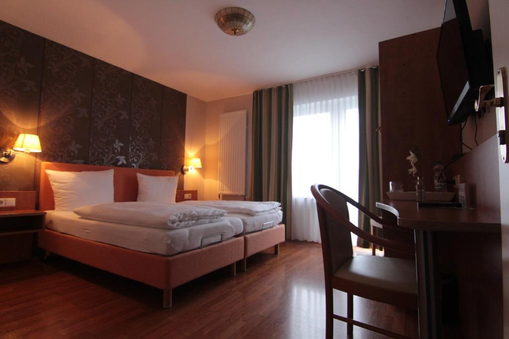 Postel nebo postele na pokoji v ubytování Hotel Linden