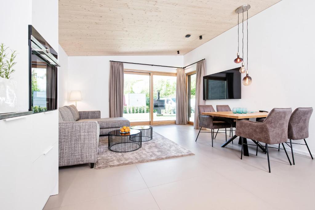 TV a/nebo společenská místnost v ubytování Apartment Velden - 24 Home im Zentrum