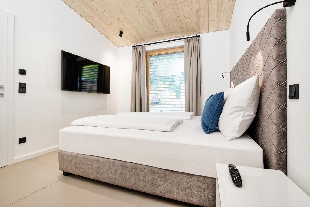 Postel nebo postele na pokoji v ubytování Apartment Velden - 24 Home im Zentrum