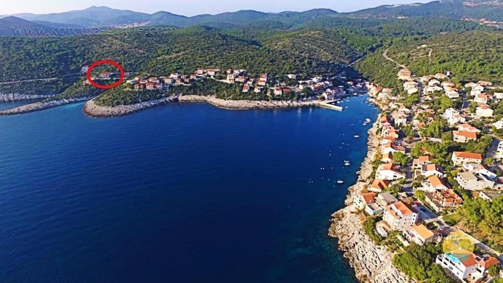 an aerial view of a small island in the water at Apartments Tanja in Zavalatica