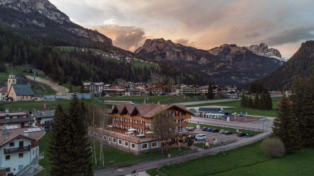 an aerial view of a town in the mountains at X Alp Hotel in Pozza di Fassa