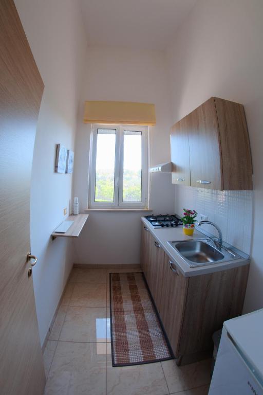 A kitchen or kitchenette at Li Carlucci