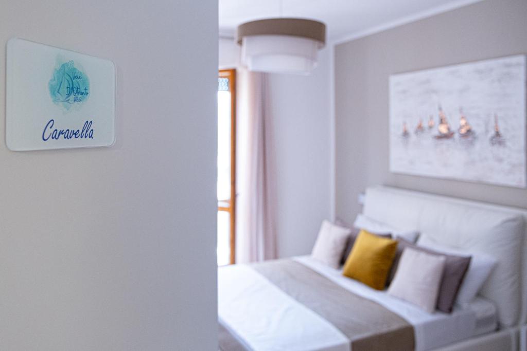 Uma cama ou camas num quarto em Vele d'Otranto B&B