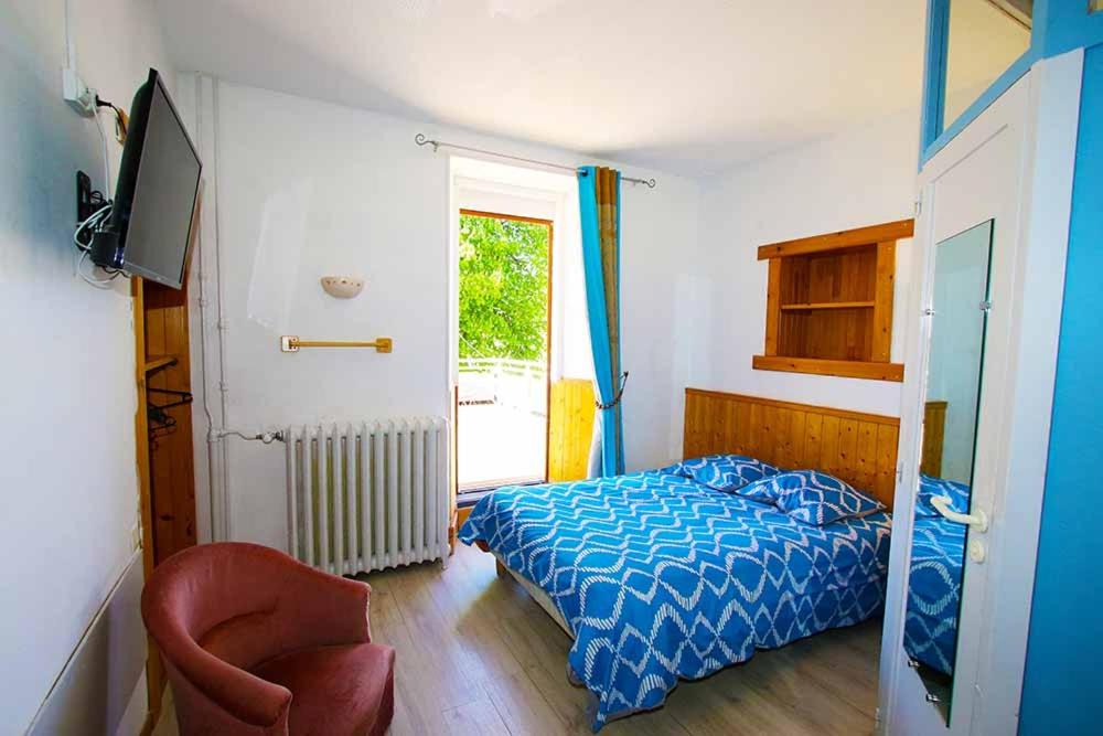 Postel nebo postele na pokoji v ubytování Pension Saint Antoine