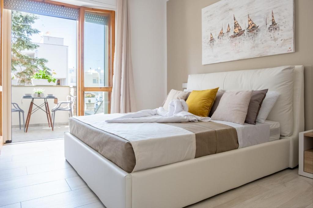 Uma cama ou camas num quarto em Vele d'Otranto B&B