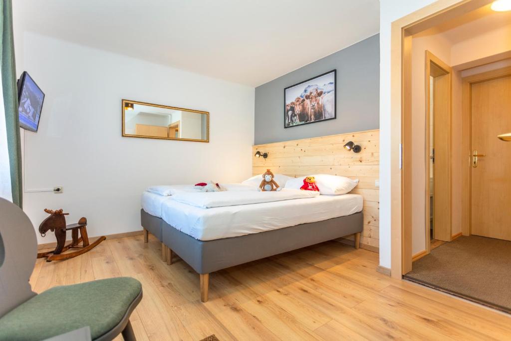 Postel nebo postele na pokoji v ubytování Sonnberg Lodge
