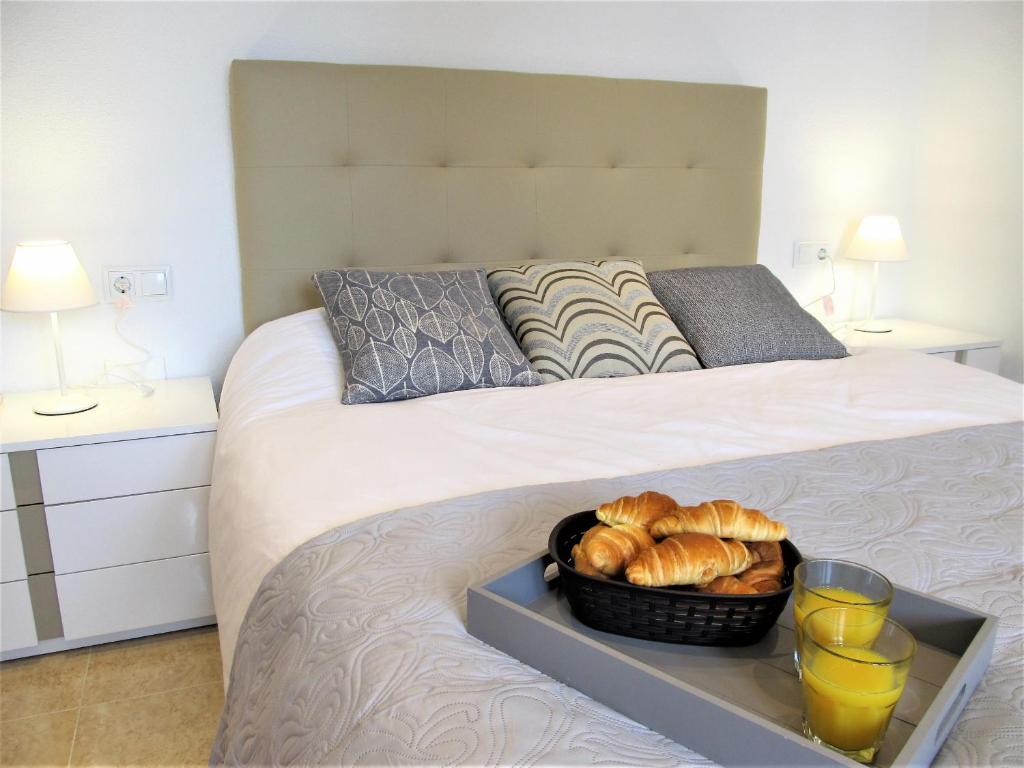 A bed or beds in a room at Spanish Connection - Playa Principe