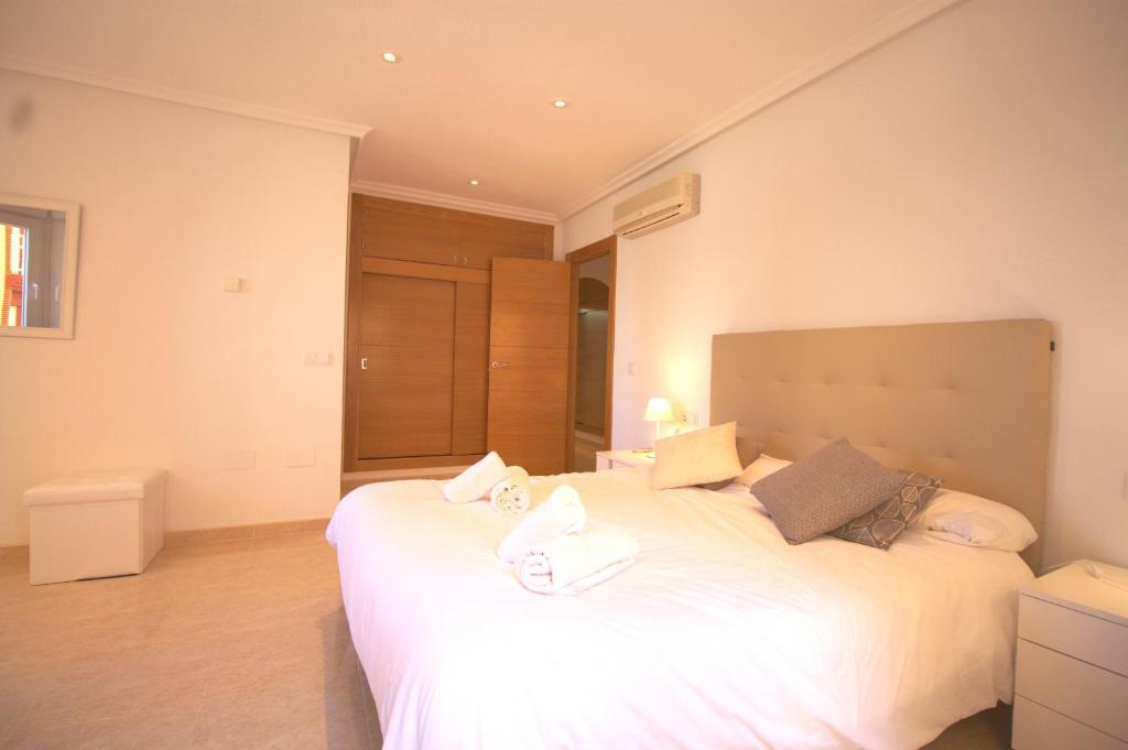 A bed or beds in a room at Spanish Connection - Playa Principe