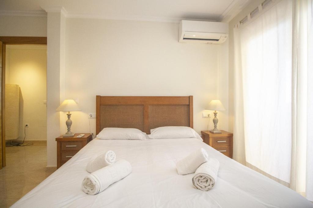 A bed or beds in a room at Spanish Connection - Playa Principe