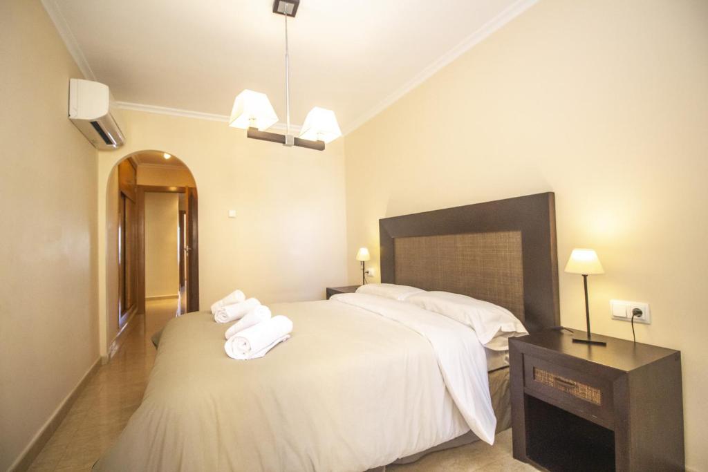 A bed or beds in a room at Spanish Connection - Playa Principe