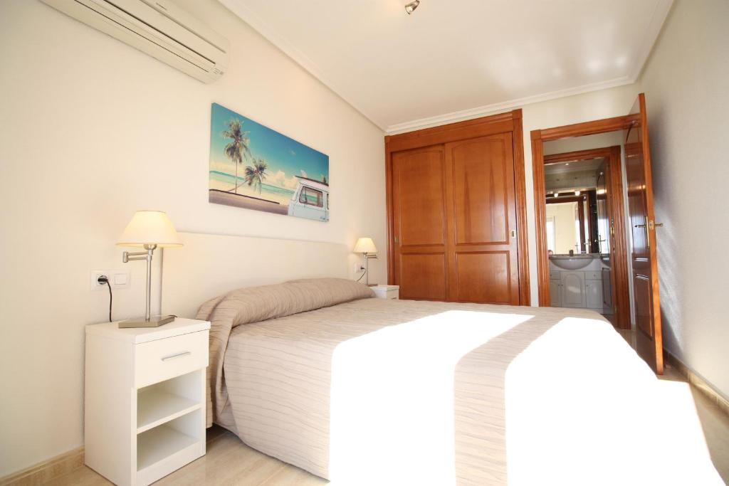 A bed or beds in a room at Spanish Connection - Seychelles