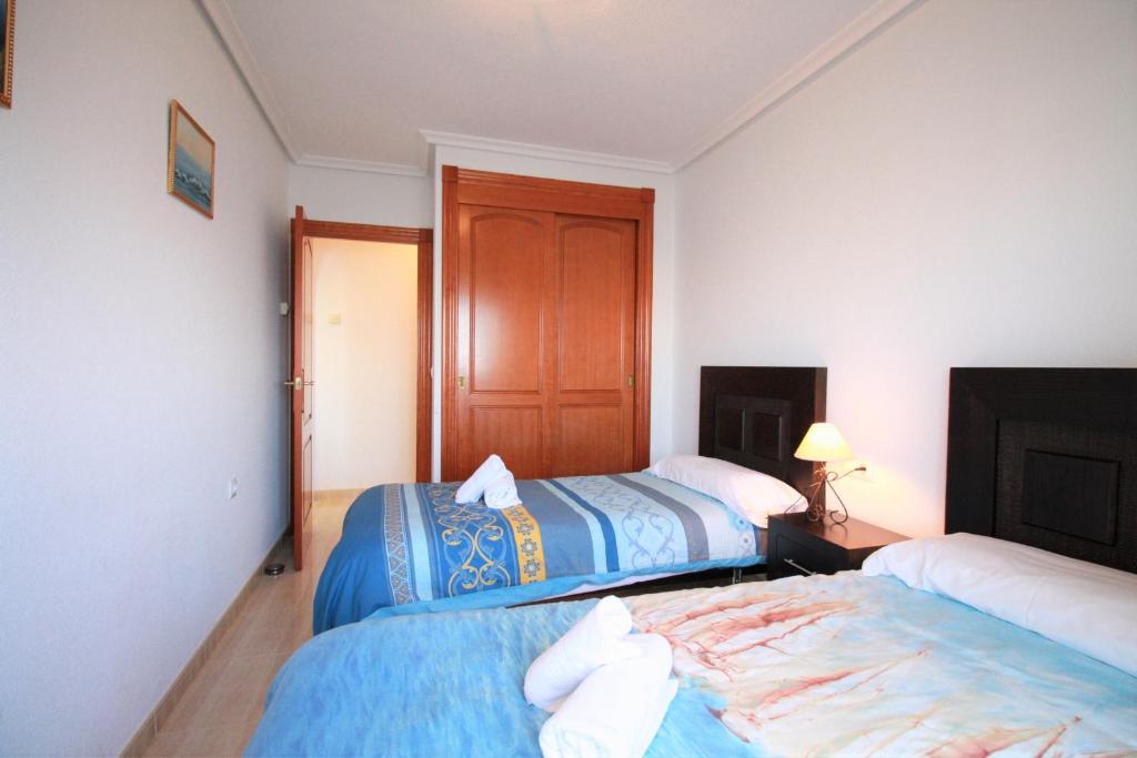 A bed or beds in a room at Spanish Connection - Seychelles