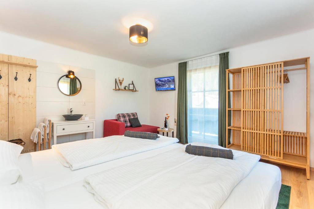 Postel nebo postele na pokoji v ubytování Sonnberg Lodge