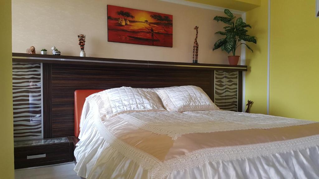 Posteľ alebo postele v izbe v ubytovaní Safari Apartman