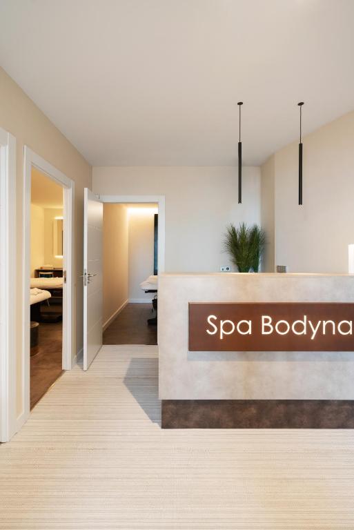 a rendering of a spa lobby with a spa bodymark sign at Hospes Amérigo, Alicante, a Member of Design Hotels in Alicante