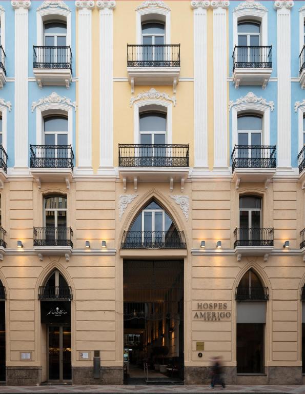 a facade of a building with windows and balconies at Hospes Amérigo, Alicante, a Member of Design Hotels in Alicante