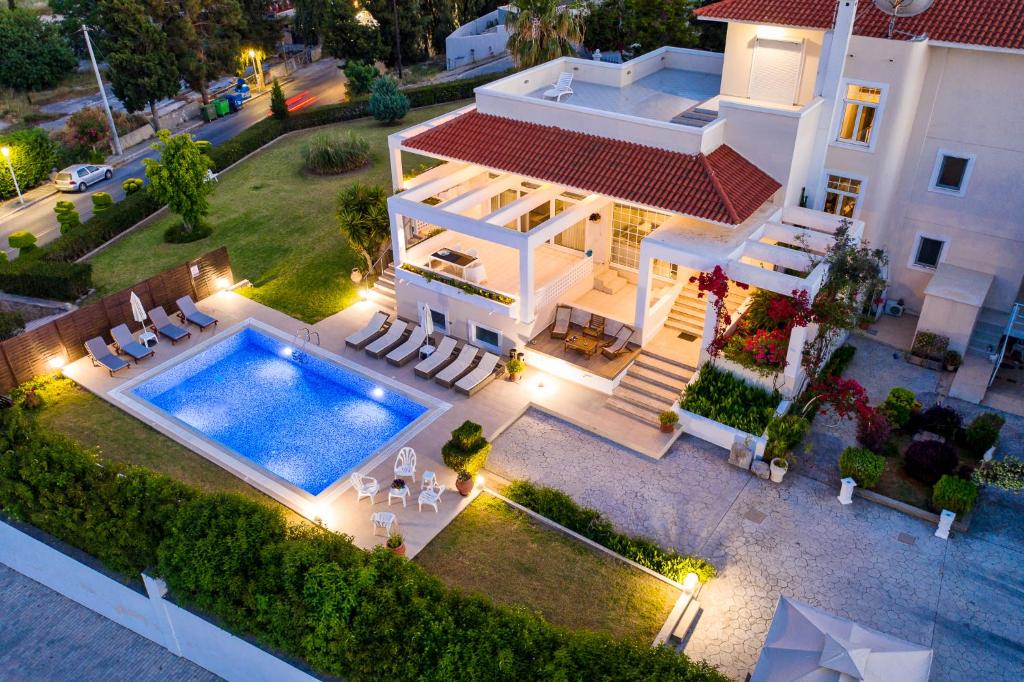 an aerial view of a house with a swimming pool at City Mansion Rhodes in Rhodes Town