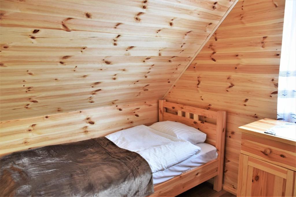 Postel nebo postele na pokoji v ubytování O.W. Sęk