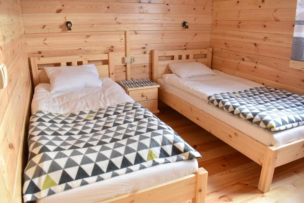 Postel nebo postele na pokoji v ubytování O.W. Sęk
