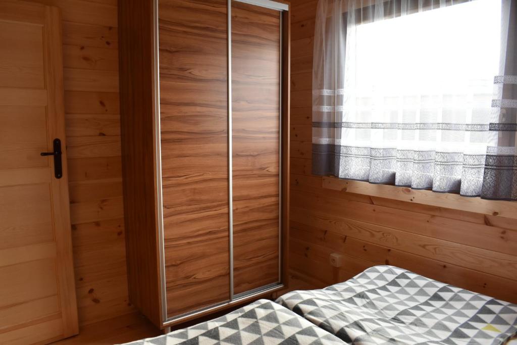 Postel nebo postele na pokoji v ubytování O.W. Sęk