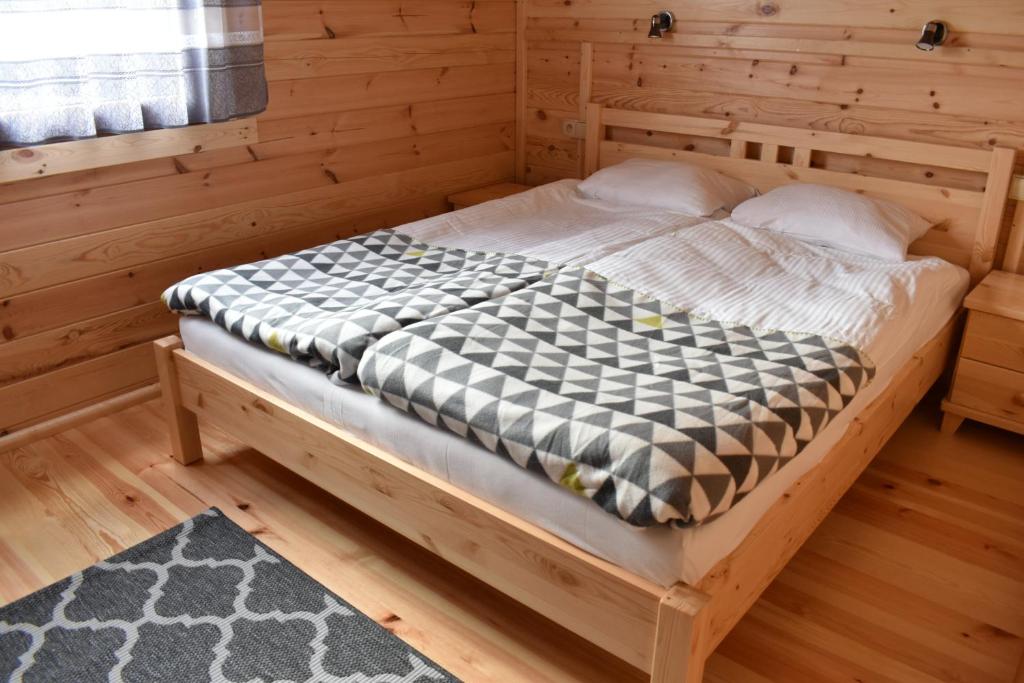 Postel nebo postele na pokoji v ubytování O.W. Sęk