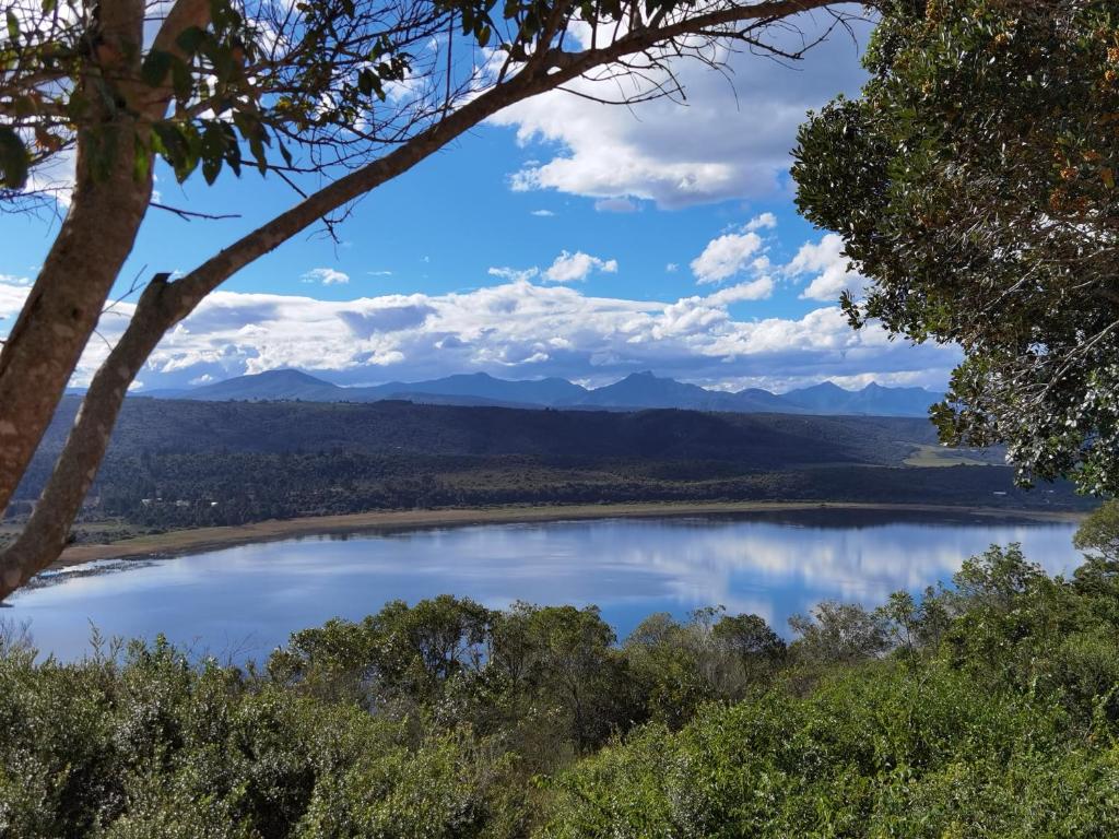a view of a lake with mountains in the background at Eagles Nest in Sedgefield