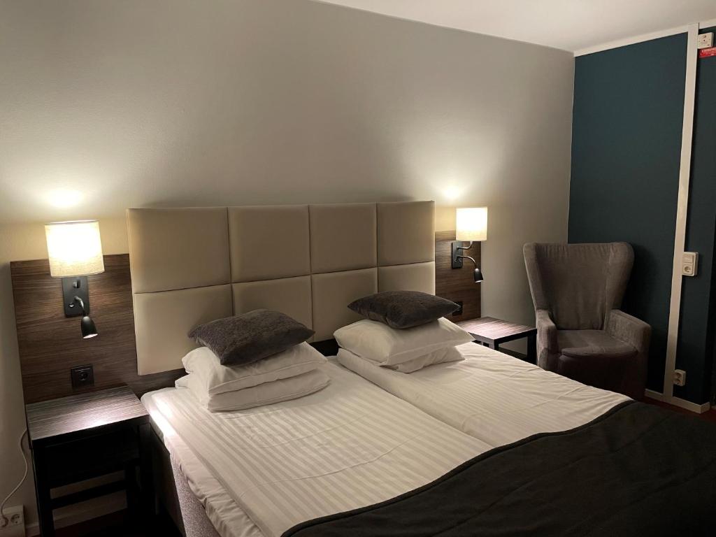 Postel nebo postele na pokoji v ubytování HOTEL N Hostel Malmö City