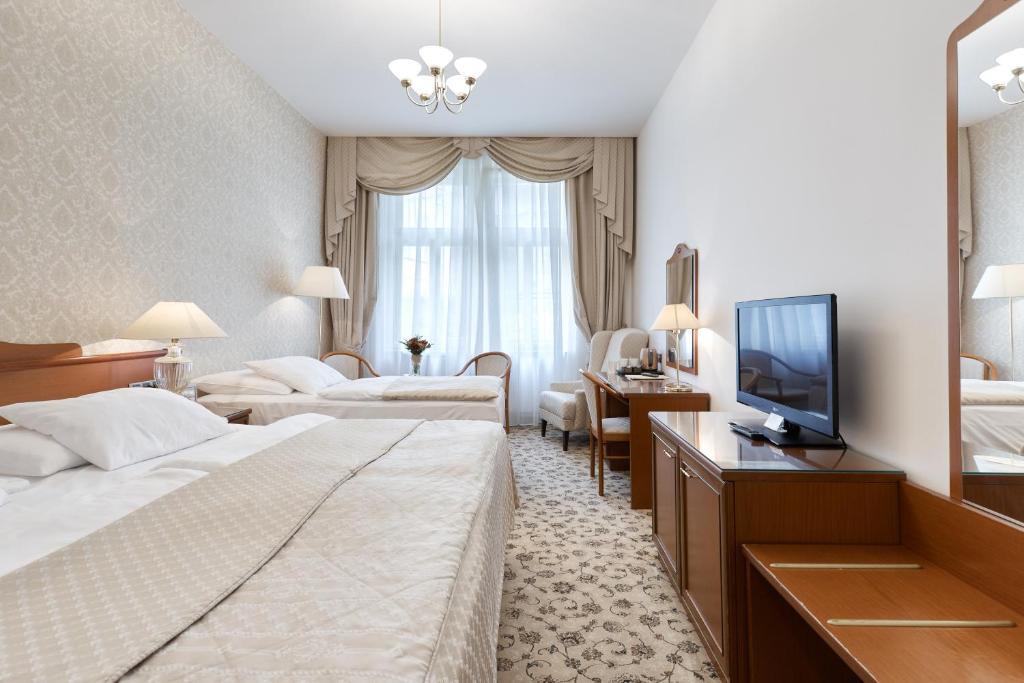 Voodi või voodid majutusasutuse Hotel Romance toas