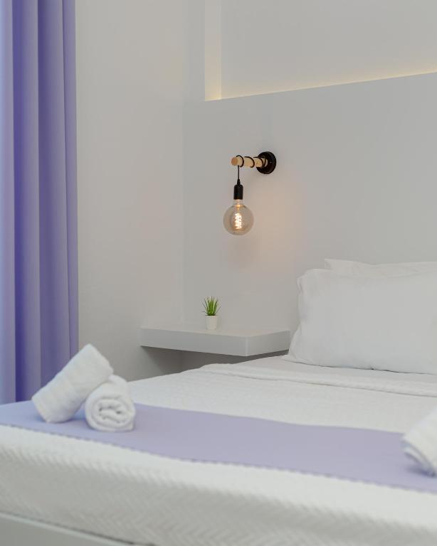 Postel nebo postele na pokoji v ubytování Venus Minimal Hotel