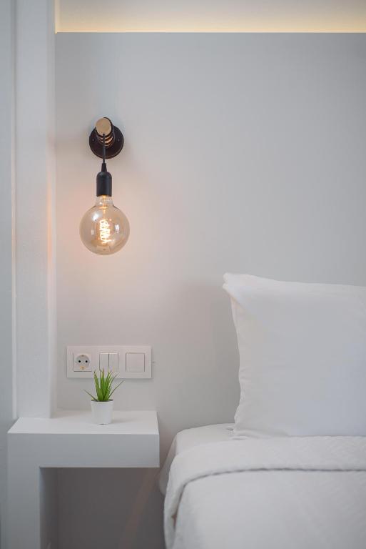 Postel nebo postele na pokoji v ubytování Venus Minimal Hotel