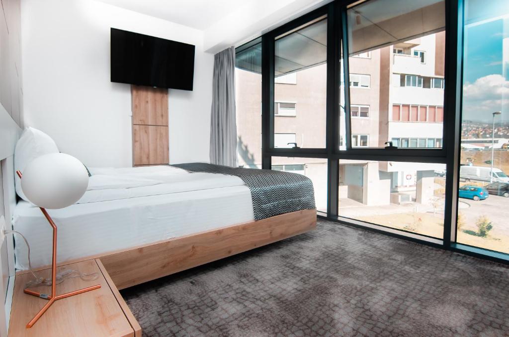 Postel nebo postele na pokoji v ubytování Hotel Koncept Residence