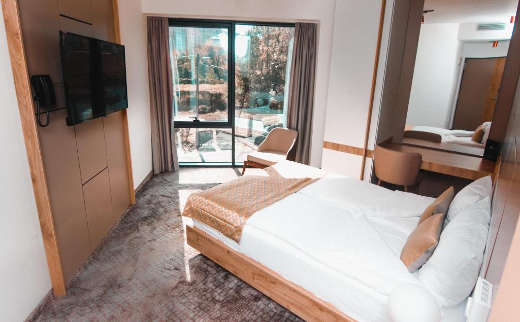 TV a/nebo společenská místnost v ubytování Hotel Koncept Residence