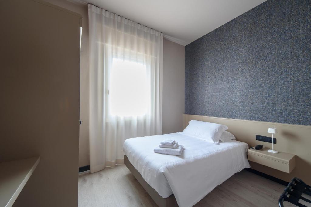 Postel nebo postele na pokoji v ubytování Hotel Zenit