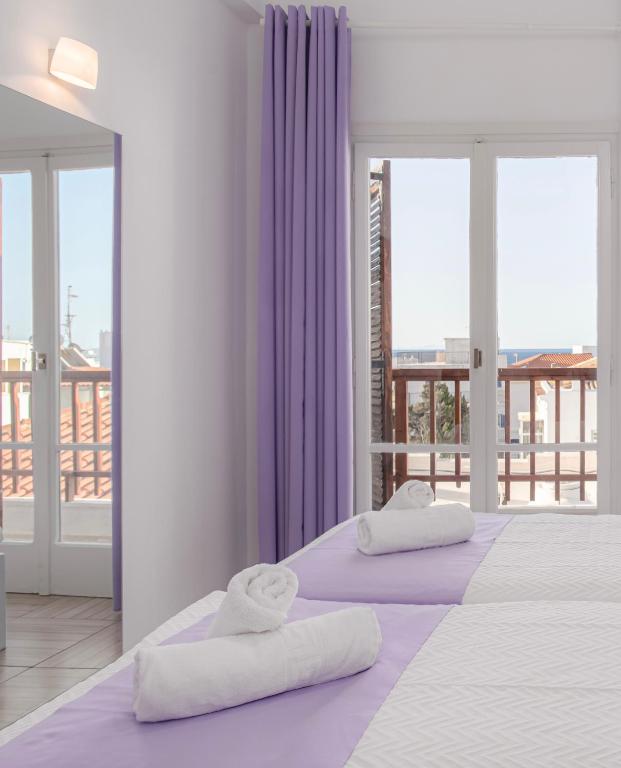 Postel nebo postele na pokoji v ubytování Venus Minimal Hotel